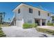 Coastal home featuring gravel landscaping, covered parking, and a light-blue metal roof at 4275 Bellaire Dr, Hernando Beach, FL 34607