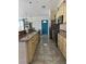 Spacious kitchen featuring custom cabinets, stainless steel appliances, and a large island with seating at 4275 Bellaire Dr, Hernando Beach, FL 34607