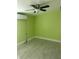 Bedroom with a ceiling fan, stylish flooring, and a mini-split air conditioner at 4503 W Minnehaha St, Tampa, FL 33614