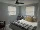 Bright bedroom with ceiling fan, neutral colors, and light-filled windows at 4503 W Minnehaha St, Tampa, FL 33614
