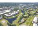 Expansive aerial perspective of the community featuring ponds, fairways, and residential buildings at 4550 Pinebrook Cir # 505, Bradenton, FL 34209