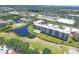 Overhead view showcasing the complex's pool, surrounding greenery, and golf course features at 4550 Pinebrook Cir # 505, Bradenton, FL 34209