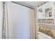 Clean bathroom with a shower/tub, vanity cabinet, and decorative elements at 4550 Pinebrook Cir # 505, Bradenton, FL 34209