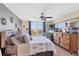 Comfortable bedroom with a large window offering natural light and outdoor views at 4550 Pinebrook Cir # 505, Bradenton, FL 34209
