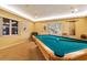Relaxing billiard room featuring a pool table and natural light from the windows at 4550 Pinebrook Cir # 505, Bradenton, FL 34209