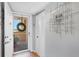 Inviting condo entrance featuring a modern door, stylish wreath, and decorative wall art, enhancing curb appeal at 4550 Pinebrook Cir # 505, Bradenton, FL 34209