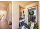 Charming condo entrance with a welcoming 'Welcome' sign, plants, and stylish decorations creating a warm ambiance at 4550 Pinebrook Cir # 505, Bradenton, FL 34209