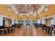 Large event space with high ceilings, wooden beams, and ample seating, perfect for gatherings at 4550 Pinebrook Cir # 505, Bradenton, FL 34209