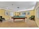 Game room featuring a pool table, comfortable seating, and bright, natural light at 4550 Pinebrook Cir # 505, Bradenton, FL 34209