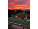 Scenic golf course view with a beautiful sunset, featuring lush green fairways and serene water hazards at 4550 Pinebrook Cir # 505, Bradenton, FL 34209