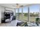 Bright living room featuring scenic views of the golf course and water views from expansive windows at 4550 Pinebrook Cir # 505, Bradenton, FL 34209