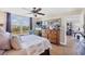 Inviting main bedroom with large windows providing natural light, ceiling fan, and a lovely dresser at 4550 Pinebrook Cir # 505, Bradenton, FL 34209