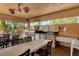 Outdoor kitchen features stainless steel grill and countertops, perfect for entertaining at 4550 Pinebrook Cir # 505, Bradenton, FL 34209