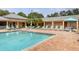 Resort style pool with ample lounging space and pristine, clear water at 4550 Pinebrook Cir # 505, Bradenton, FL 34209