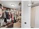 Spacious walk-in closet offering ample storage with shelves, hanging rods, and an ottoman at 4550 Pinebrook Cir # 505, Bradenton, FL 34209