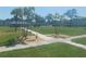 A well-maintained park and walking paths in a light blue building at 4715 Bay Ne St # 119, St Petersburg, FL 33703