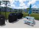 Outdoor picnic area with table, benches, grills and a shade umbrella for community gatherings at 4715 Bay Ne St # 119, St Petersburg, FL 33703