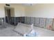 Empty room during a renovation project with studs and concrete blocks exposed on the walls at 4715 Bay Ne St # 119, St Petersburg, FL 33703