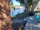 Backyard views of the canal with lush landscaping, perfect for outdoor living at 5830 Portsmouth Dr, Tampa, FL 33615