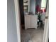 Well-lit bathroom with a white vanity and a decorative ocean-themed shower curtain at 5830 Portsmouth Dr, Tampa, FL 33615