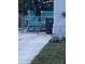 A side view of a manufactured home, showing a fenced in patio at 5830 Portsmouth Dr, Tampa, FL 33615