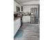 Bright kitchen featuring white cabinets, granite countertops, and stainless steel appliances at 5830 Portsmouth Dr, Tampa, FL 33615