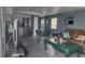 Open concept living room with kitchen, dining area, and comfortable seating arrangement at 5830 Portsmouth Dr, Tampa, FL 33615