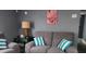 Living room featuring a cozy couch with pillows and fall themed decorations at 5830 Portsmouth Dr, Tampa, FL 33615