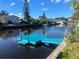 Waterfront home with a private dock providing access to water activities at 5830 Portsmouth Dr, Tampa, FL 33615