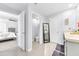 Bright bathroom featuring a double vanity with modern fixtures, and tiled floors at 636 Sunlit Coral St, Ruskin, FL 33570