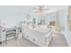 Bright bedroom featuring a full bed with storage, a study desk, and a stylish ceiling fan at 636 Sunlit Coral St, Ruskin, FL 33570