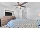 Cozy bedroom with a TV on a dresser and a ceiling fan for added comfort at 636 Sunlit Coral St, Ruskin, FL 33570