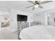 Spacious bedroom with a ceiling fan and a neutral color scheme, ideal for relaxation at 636 Sunlit Coral St, Ruskin, FL 33570
