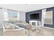 Stylish living room with navy accent wall, comfortable seating, and modern entertainment center at 636 Sunlit Coral St, Ruskin, FL 33570