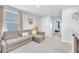 Cozy upstairs living area with a comfortable couch and a glimpse into the bedroom at 636 Sunlit Coral St, Ruskin, FL 33570