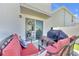 Relaxing outdoor patio featuring comfortable seating, a grill, and sliding glass doors at 636 Sunlit Coral St, Ruskin, FL 33570