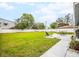 Sprawling backyard featuring a well-maintained lawn and patio seating, perfect for outdoor relaxation and entertaining at 7111 13Th E St, Sarasota, FL 34243