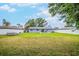 A large backyard with a well-maintained lawn, offering plenty of space for Gathering activities and outdoor enjoyment at 7111 13Th E St, Sarasota, FL 34243