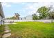 Expansive backyard offering ample green space, ideal for recreation, featuring a well-maintained lawn at 7111 13Th E St, Sarasota, FL 34243
