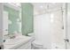 Functional bathroom with a shower, large mirror, and minimalist decor at 7111 13Th E St, Sarasota, FL 34243