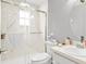 Bright bathroom with glass shower doors, modern fixtures, and a clean, stylish design at 7111 13Th E St, Sarasota, FL 34243