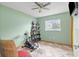 Exercise equipment within a bedroom featuring neutral colors, tile floors and lots of natural light at 7111 13Th E St, Sarasota, FL 34243