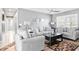 Comfortable living room with plush seating, a modern ceiling fan, and stylish decor at 7111 13Th E St, Sarasota, FL 34243