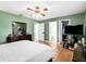 Spacious main bedroom featuring an en suite bathroom, closet, and comfortable furnishings at 7111 13Th E St, Sarasota, FL 34243