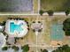 A bird's-eye view of the community amenities, featuring a pool, park, basketball court, and playground at 718 S 22Nd St, Tampa, FL 33605