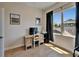 Bright bedroom with a large window, hardwood floors, and a simple desk setup at 718 S 22Nd St, Tampa, FL 33605