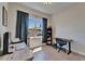 Bright bedroom with a large window, hardwood floors, and a dedicated workspace at 718 S 22Nd St, Tampa, FL 33605