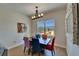Dining room with colorful chairs, a modern chandelier, and a window with a view of the outdoors at 718 S 22Nd St, Tampa, FL 33605