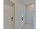Well-lit entryway with tiled floor and modern white door creates a clean, inviting space at 718 S 22Nd St, Tampa, FL 33605