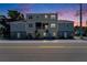 Charming two-story exterior featuring a mix of brick and neutral siding, complemented by inviting blue door at 718 S 22Nd St, Tampa, FL 33605